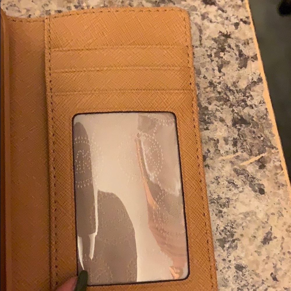 iPhone 5c Michaels Kors leather wristlet.